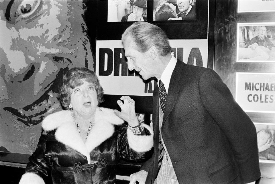 Black and white photo of Jean Ferguson portraying Hylda Baker in a theatre production.