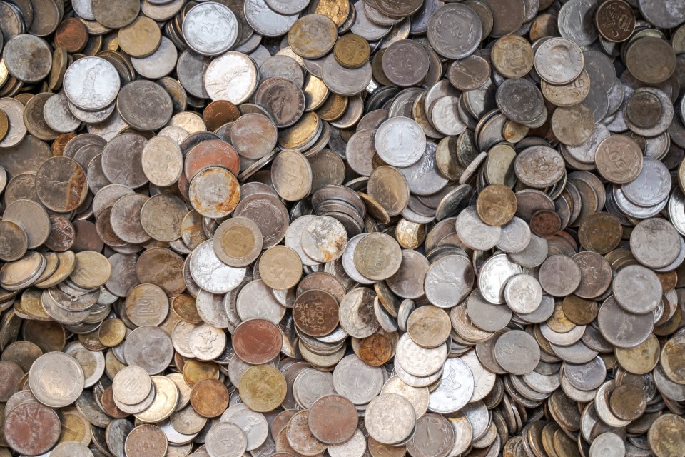 Pile of old, tarnished coins.