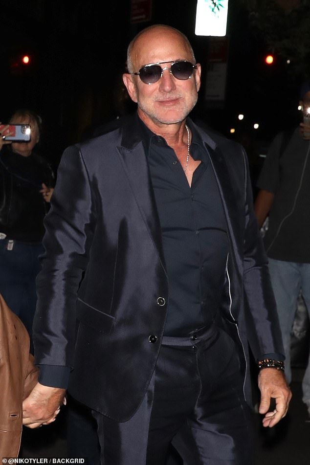 As for Bezos, the Amazon founder looked sharp in a black suit and dress shirt