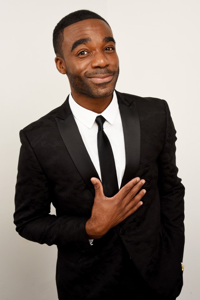 Ore Oduba in a black suit.