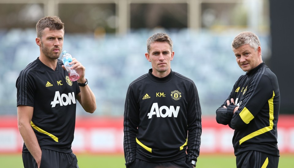 Manchester United coaches Michael Carrick, Kieran McKenna, and Ole Gunnar Solskjaer at a training session.