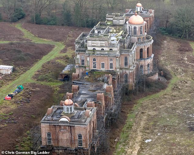 But the tycoon has now finally revealed why works have been stalled for so long and his plans for its future. Pictured last year: A close up of the main building which shows the amount of scaffolding that still surrounds the property in Uckfield, East Sussex
