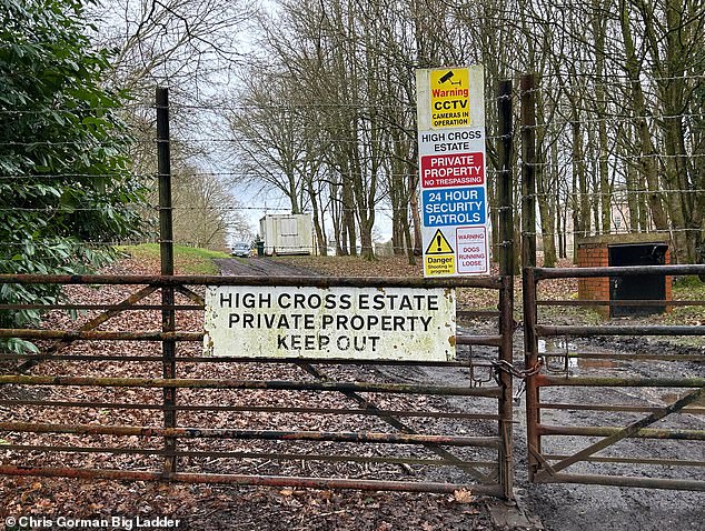 The estate is tightly secured with one entry point gate firmly locked shut. Barbed wire can also be seen on the top