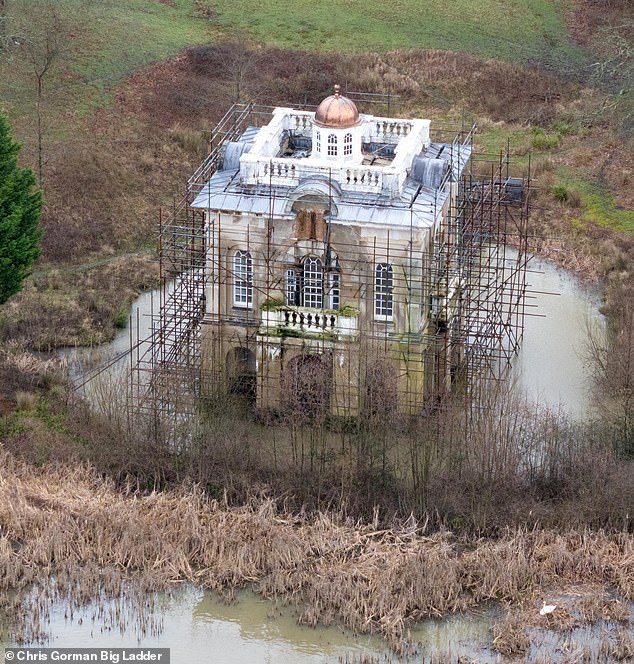 A second building close to the water is also still under construction and has scaffolding on it