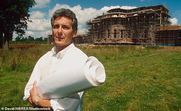 Hoogstraten pictured holding construction plans in front of the mansion in 1998