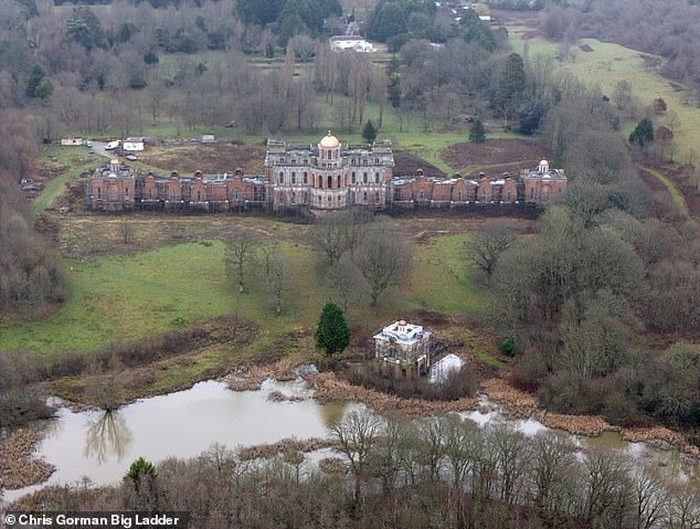 Construction containers can be seen at the back of the lavish property, which is located near Uckfield, in East Sussex