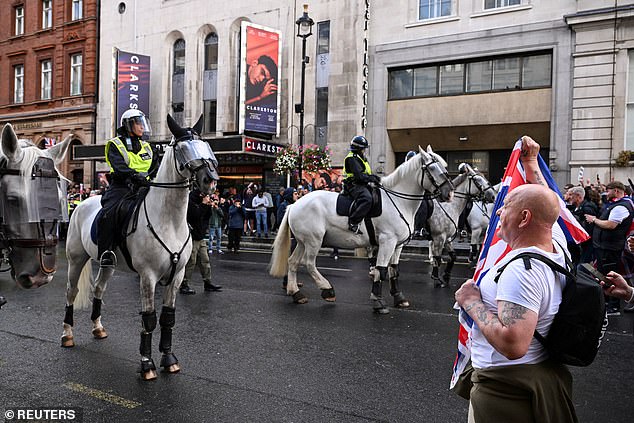 Mounted police officers were deployed to maintain distance between the two groups of protesters