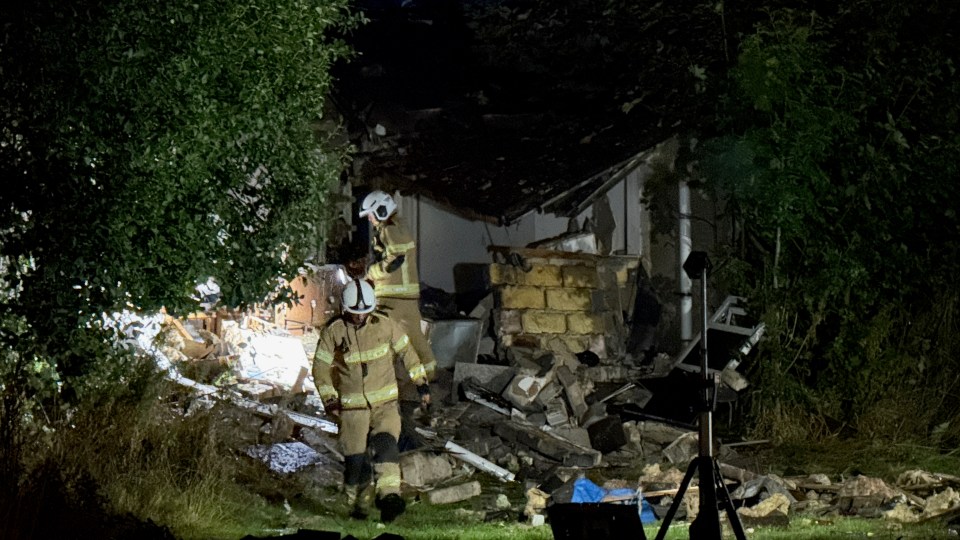 Firefighters at the scene of a residential explosion.