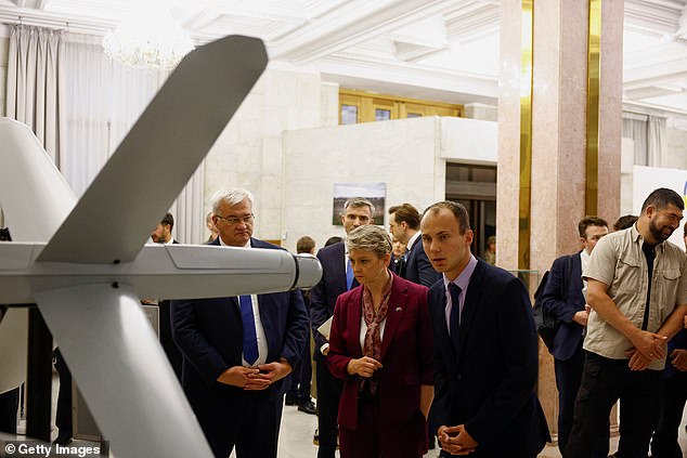 Ukrainian Foreign Minister Andrii Sybiha and British Foreign Secretary Yvette Cooper visit an exhibition showcasing Ukrainian unmanned vehicles