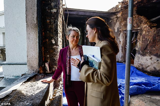 Foreign Secretary Yvette Cooper (L) and Prime Minister of Ukraine Yulia Svyrydenko visit the headquarters of the Ukrainian Cabinet of Ministers, which was damaged during a recent missile and drone attack