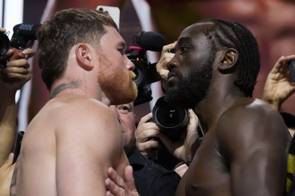 Canelo Alvarez and Terence Crawford facing off at a weigh-in.