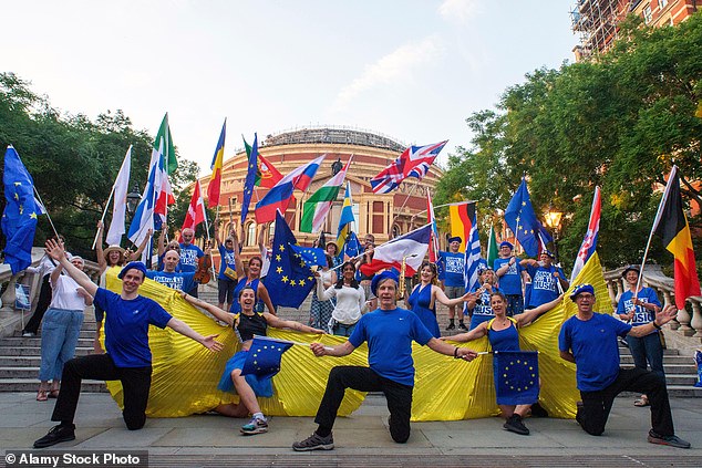 Inside the hall, a sea of flags filled the crowd - thousands of Union Jacks alongside around 10,000 EU flags distributed by pro-EU activists. Pictured: The team that delivered the EU flags and berets outside the Albert Hall
