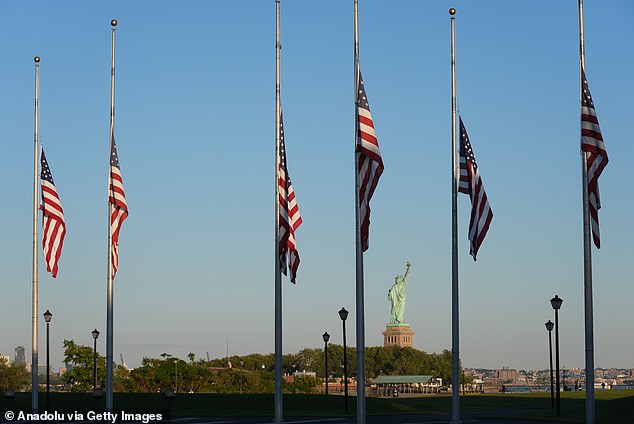 Some flags in New Jersey were indeed lowered to half-mast. Pictured, flags at the Flag Plaza with the Statue of Liberty in the background