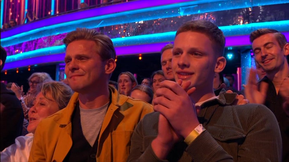 Jeff Brazier and his son Freddie watching a dance performance.