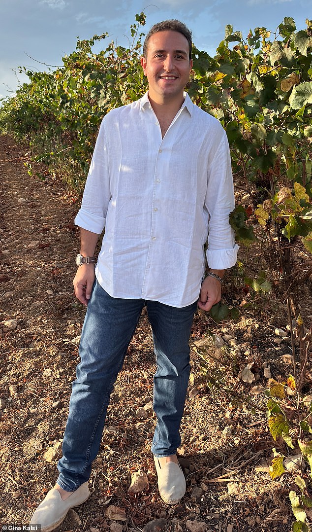 Francesco Tola, owner of Tola winery, is pictured in the depths in his sun-drenched vineyard in Sicily