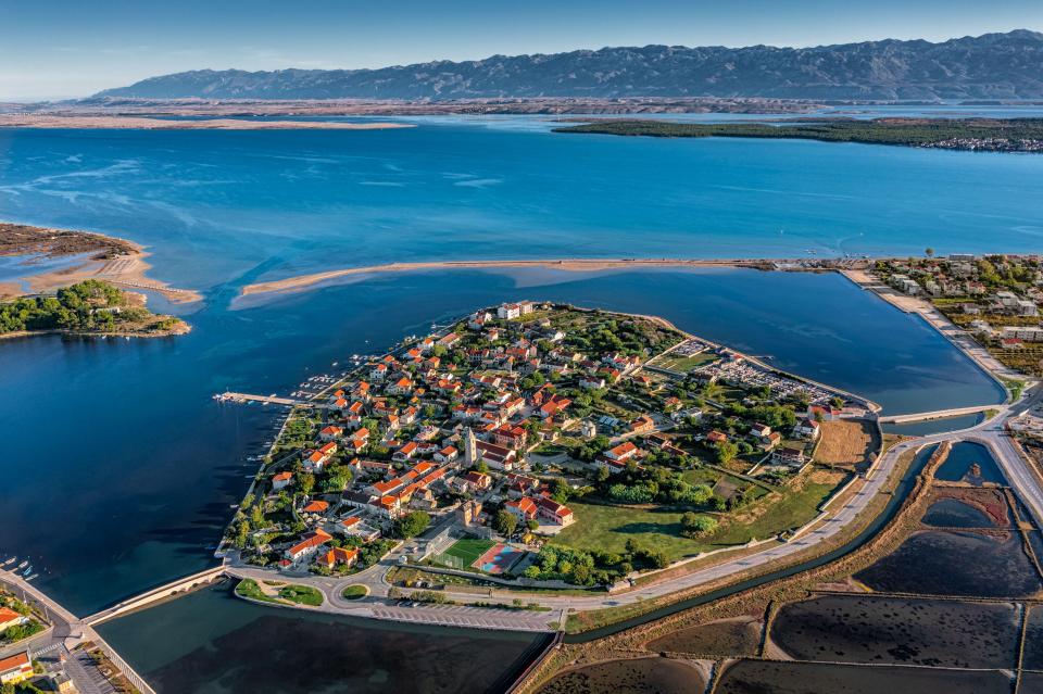 Aerial view of Nin, Croatia, showing the historic town and surrounding waterways.