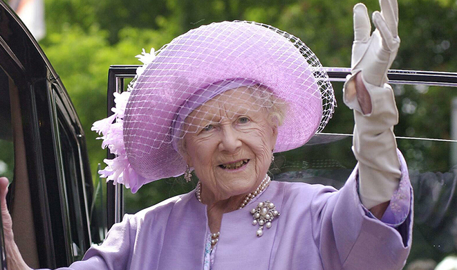 The Queen Mother waving from a car.