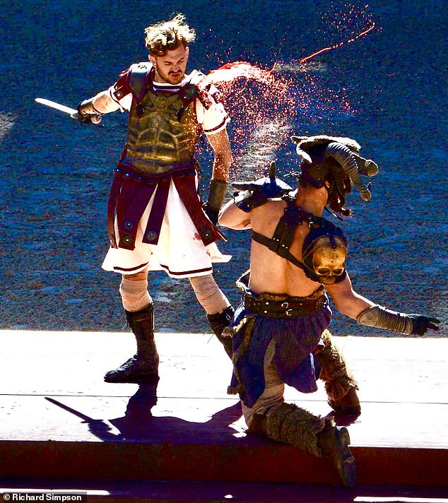 Theme park fans will say bonjour to Puy du Fou, which recreates some of history's more bloodthirsty moments; the successful theme park brand is heading to UK shores in 2029 (Pictured: A live re-enactment at Puy du Fou theme park)