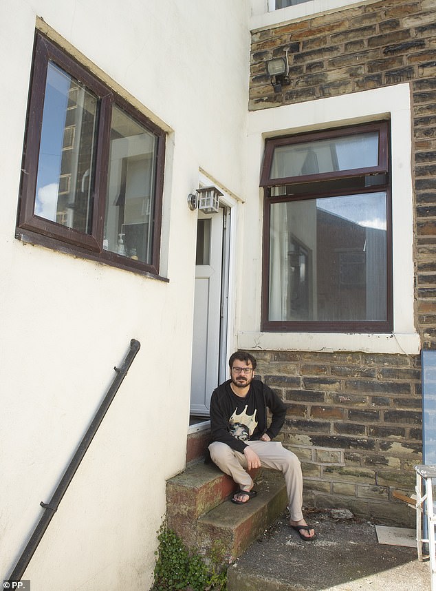 Dere (above) lives with three other men in a four-bed Victorian end-terrace in Burnley