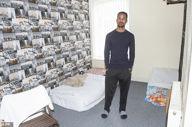 Nahusenay sleeps on a mattress on the floor in his HMO house after arriving in May this year