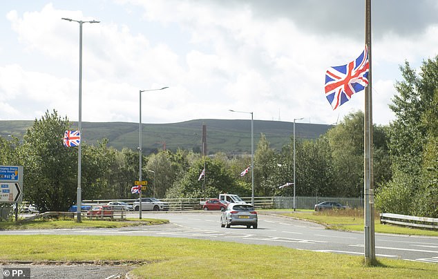 Union flags are spotted near a roundabout in Burnley amid Operation Raise the Colours