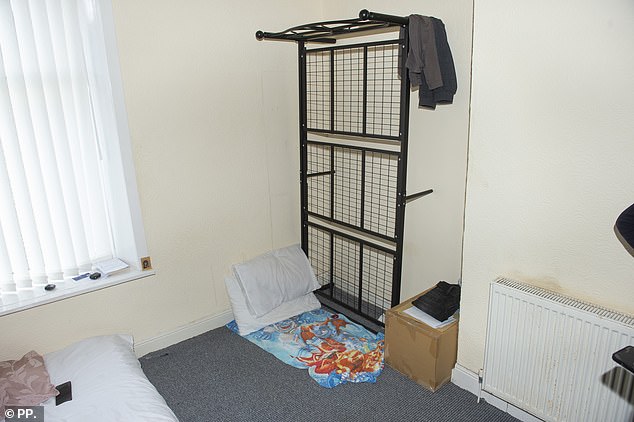 Nahusenay said his back was aching when he tried to sleep on the iron bed frame (above)