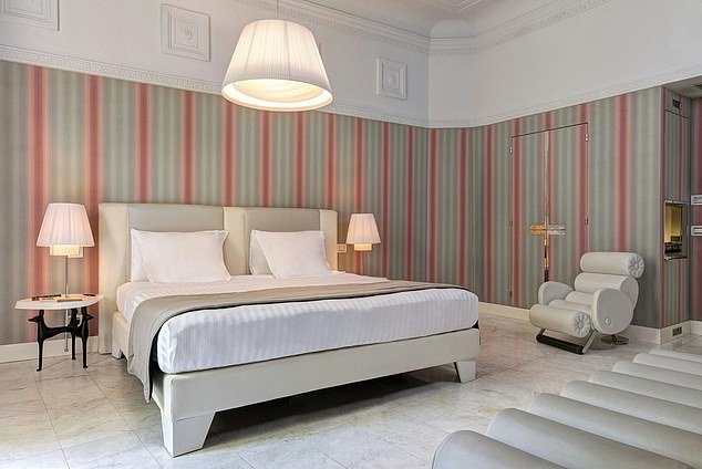 The rooms at the Grand Hotel Palace are simple yet chic, with elegant marble flooring and a comfortable bed