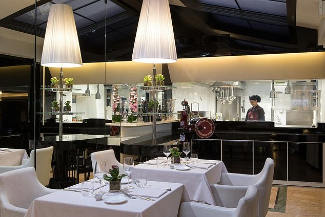 The menu at the Cadorin restaurant is executed by a team of chefs who can be seen at work if diners get a prime position