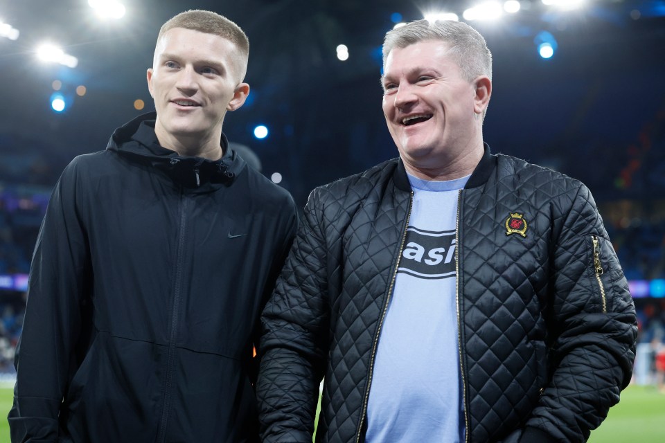 Campbell Hatton and Ricky Hatton at a soccer match.