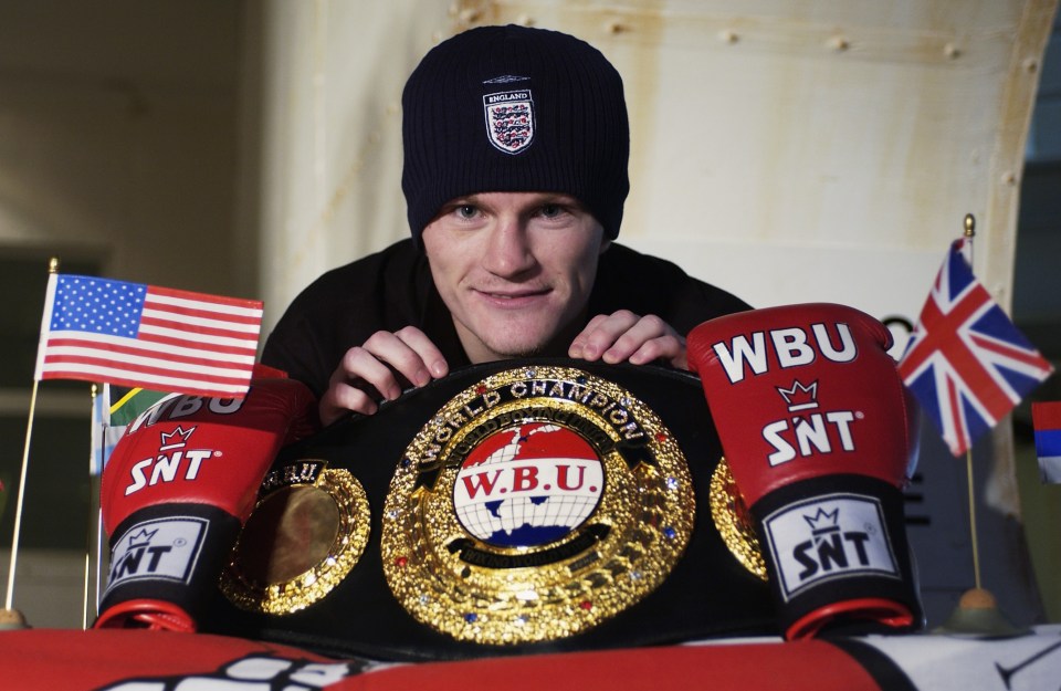 Ricky Hatton, England boxer, holding a WBU boxing championship belt.