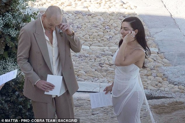 The couple appeared deeply moved during the intimate ceremony, alternating between laughing, crying and holding hands, as they took turns reading out their vows
