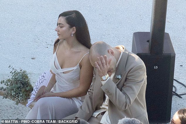 George was seen wiping away tears at several points, while their closest friends and family gave speeches and one serenaded them on the guitar