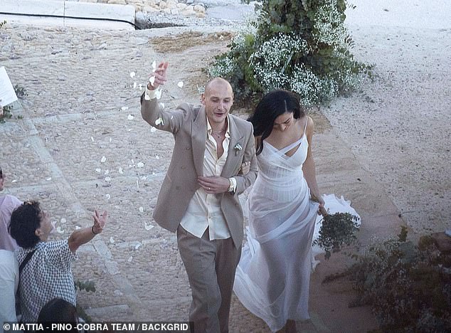 As they walked back down the aisle to applause and confetti from the attendees, Matty could be seen getting to his feet to cheer them on.