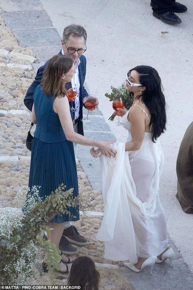 And guests were also seen sipping on the classic Italian party staple of Aperol Spritz as they laughed and danced in the sun