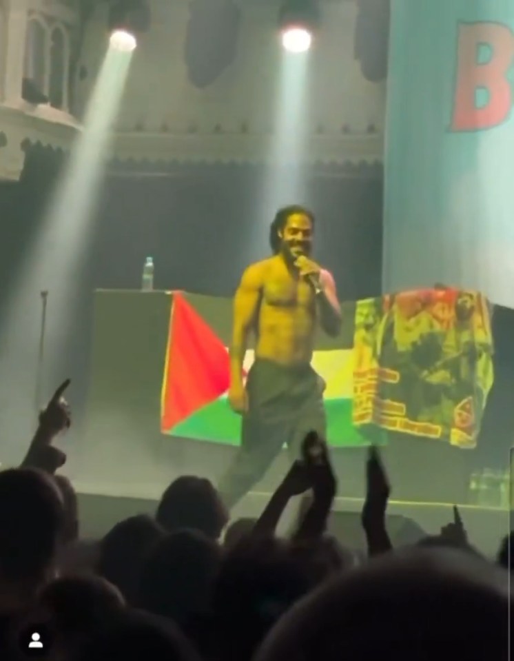 Bob Vylan performing shirtless on stage.