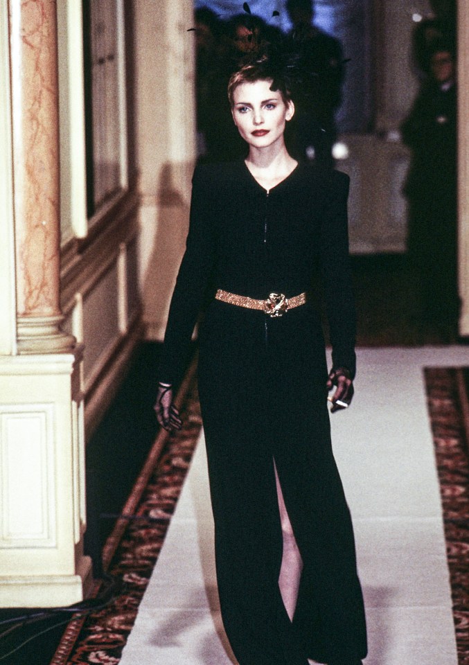 Nadja Auermann walking the Chanel Haute Couture Spring/Summer 1996 fashion show in Paris.