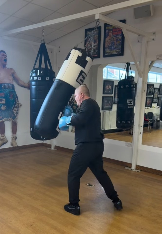 Ricky Hatton boxing a heavy bag.