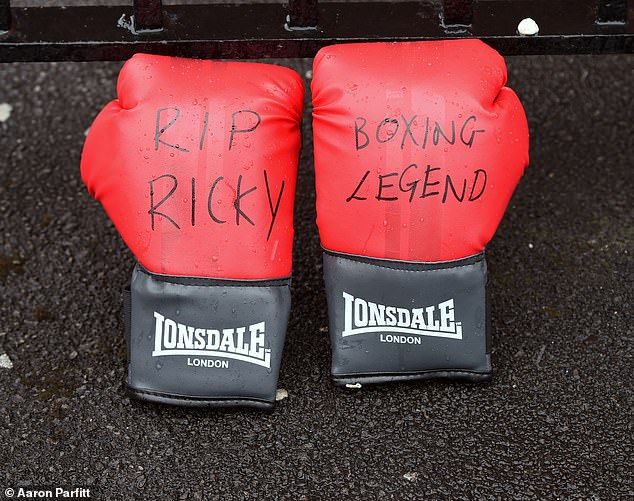 Flowers and Boxing Gloves are left outside Ricky Hatton's gym in Hyde, Manchester after his shock death