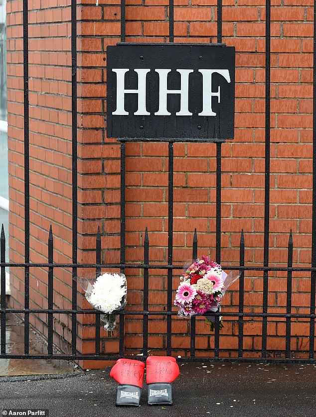 Flowers and Boxing Gloves are left outside Ricky Hatton's gym in Hyde, Manchester after his shock death