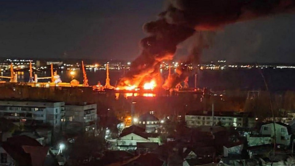 26/12/2023 - CRIMEA - Russia has confirmed one of its warships has been damaged in a Ukrainian attack on a Black Sea port. The airstrike took place at Feodosiya in Russian-occupied Crimea early on Tuesday morning. Russia's Ministry of Defence said the large landing ship Novocherkassk was struck by Ukrainian aircraft carrying guided missiles. The head of the Ukrainian Air Force said earlier its warplanes had destroyed the ship. One person was killed in the attack, according to the Russian-installed head of Crimea, Sergei Aksyonov. Several others were reportedly hurt. Six buildings were damaged and a small number of people had to be taken to temporary accommodation centres, Mr Aksyonov added. The port's transport operations are said to be functioning as normal after the area was cordoned off, while a fire caused by the attack was contained...PICTURE: UNPIXS 26/12/2023
