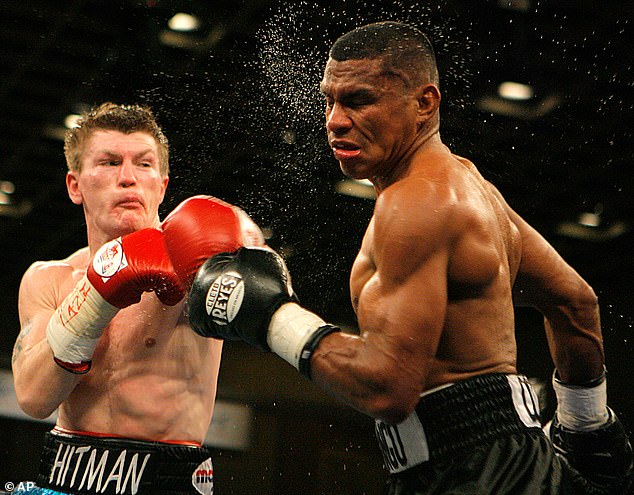 The aggressive, brave fighter (pictured with Colombian boxer Juan Urango in 2007), known as 'the Hitman', held multiple world and UK titles, winning 45 of his 48 professional bouts