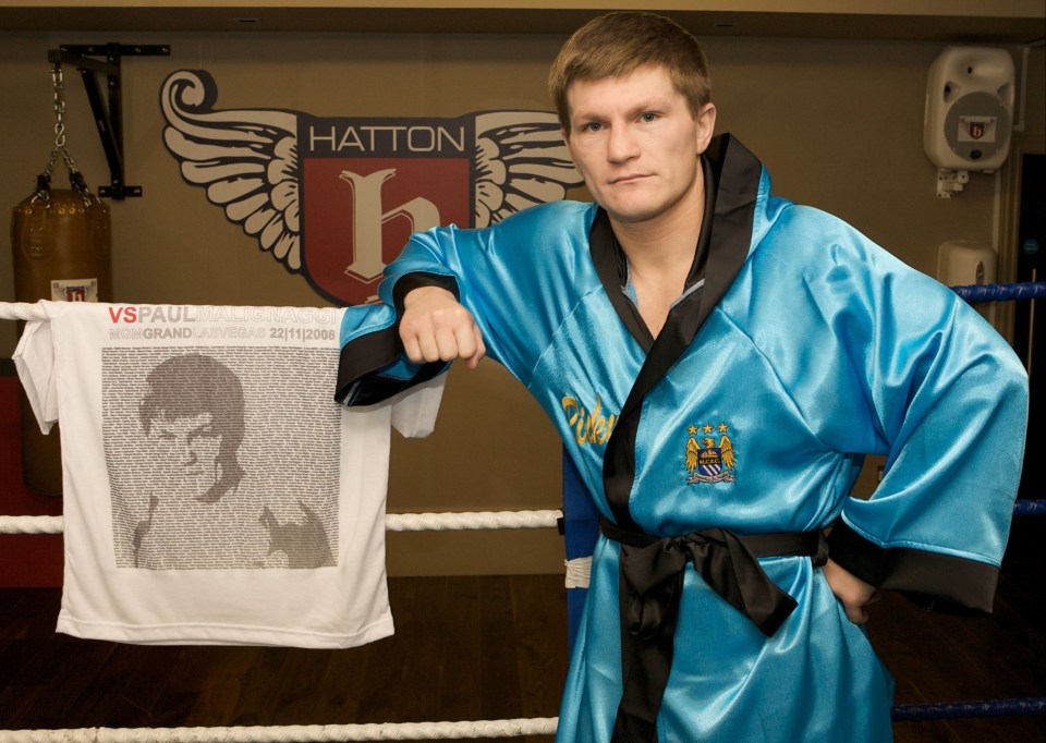 Boxer Ricky Hatton with a competition prize robe and t-shirt.