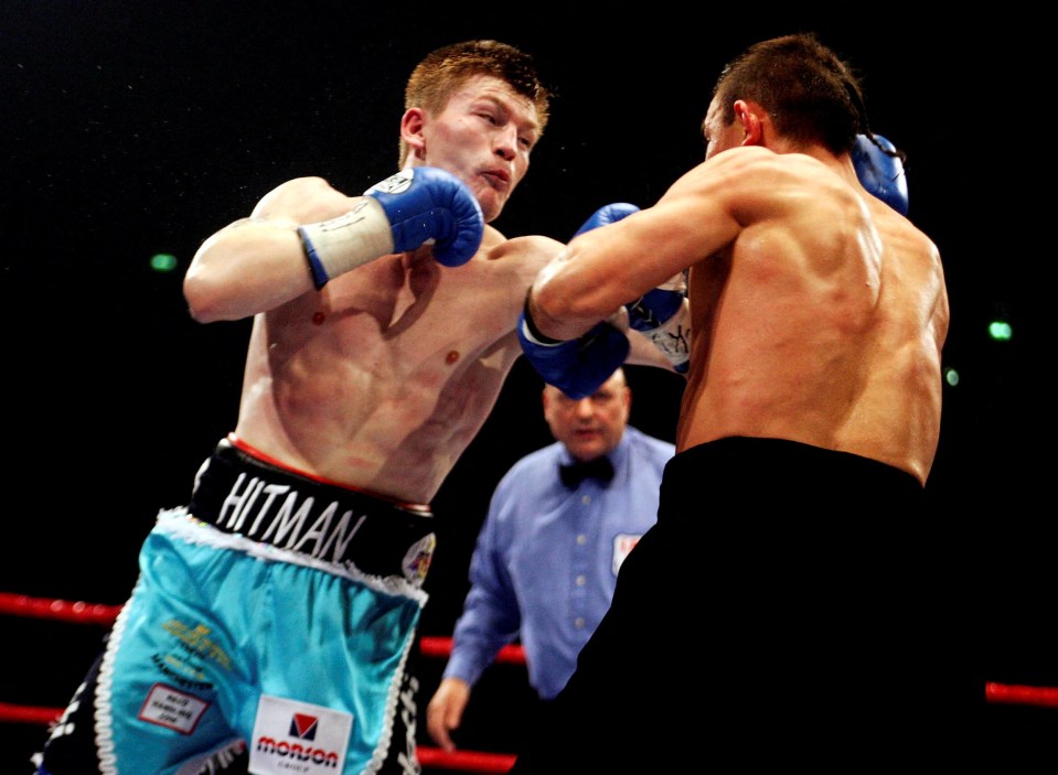 Ricky Hatton landing a punch on Kostya Tszyu in a boxing match.