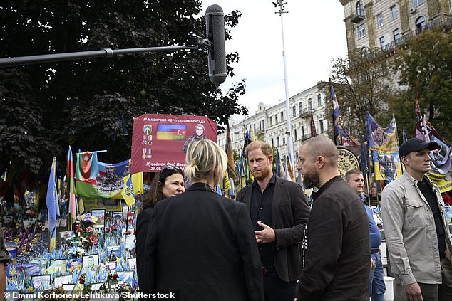 Prince Harry visits a makeshift memorial for Ukrainian and foreign soldiers in Kyiv today