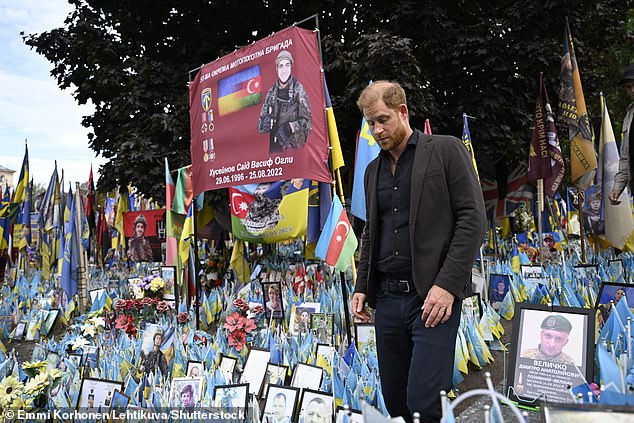 Prince Harry visits a makeshift memorial for Ukrainian and foreign soldiers in Kyiv today