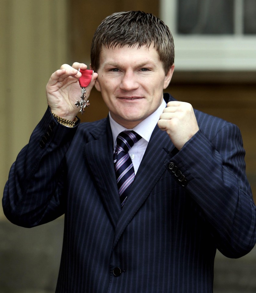 Ricky Hatton holding his MBE at Buckingham Palace.