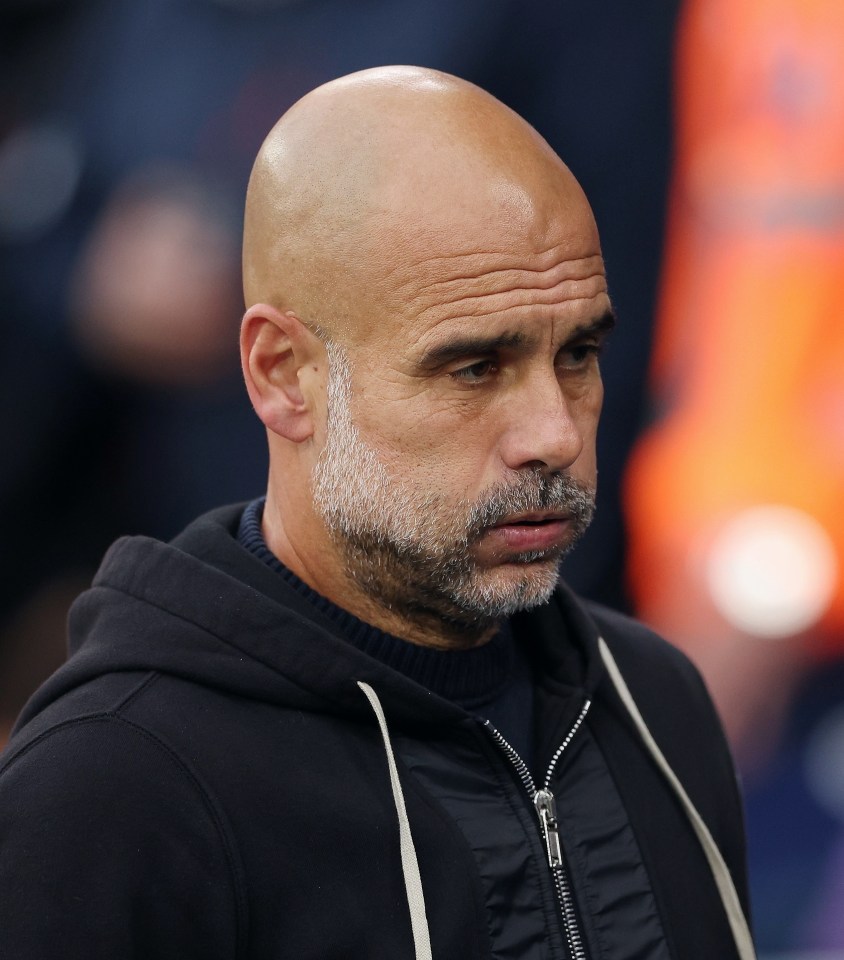 Pep Guardiola looking on.