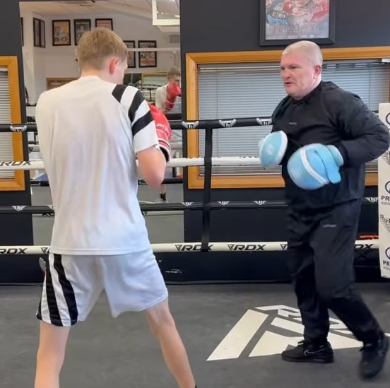 Ricky Hatton coaching a young boxer.