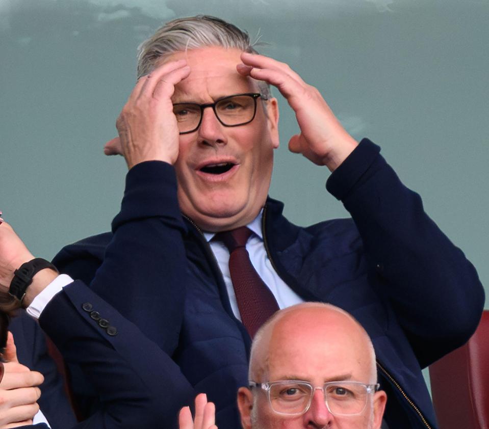 Prime Minister Sir Keir Starmer celebrating at an Arsenal soccer game.