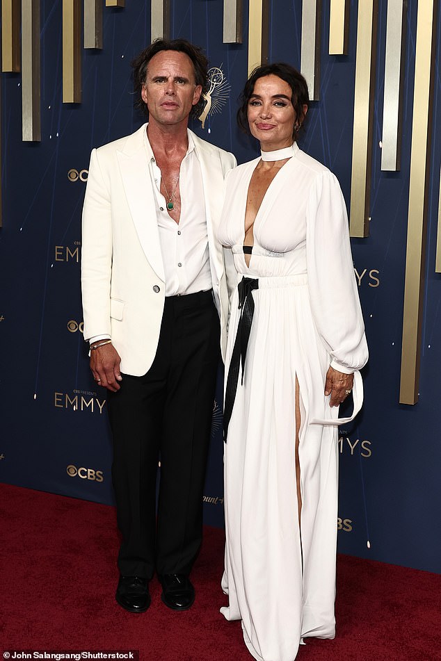 Nadia stunned in a busty flowing white gown with a black belt